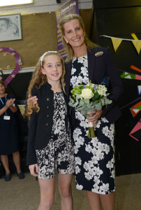Lily Farr presenting HRH with flowers